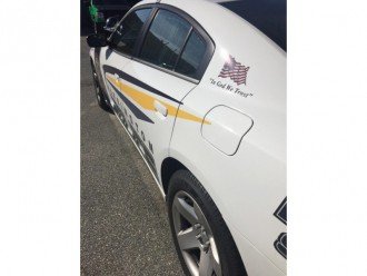 На поліцейських автомобілях США з'являться національні гасла